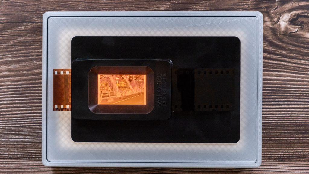 Top-down scanning POV with the Raleno 104 lightbox and the Valoi 35mm film carrier, light revealing the 3D-printed infill pattern