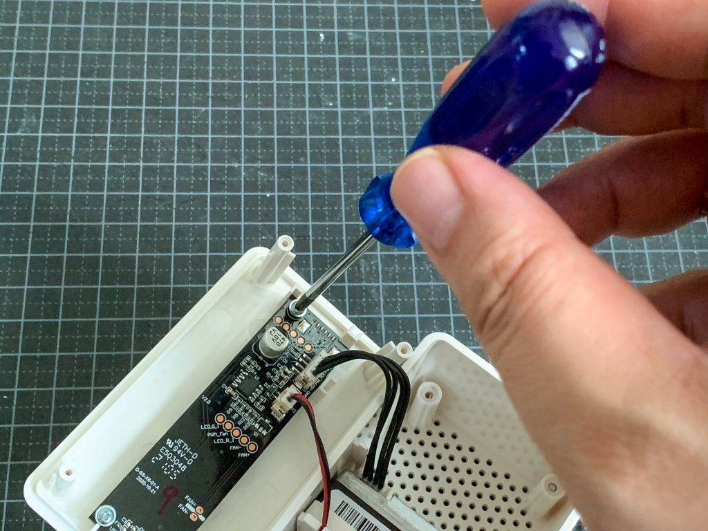 Unscrewing the IKEA VINDRIKTNING PCB from the case